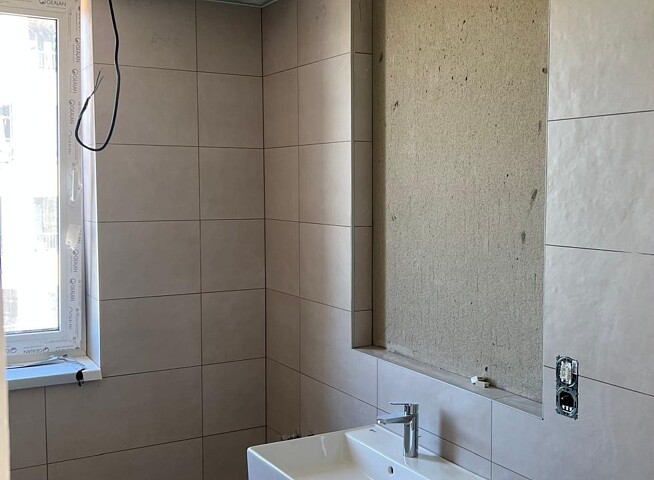 Dokončování bytových domů a práce na komunikacích